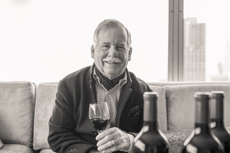 Image of Fred Schrader, founder of Schrader Cellars and Double Diamond, holding a glass of wine
